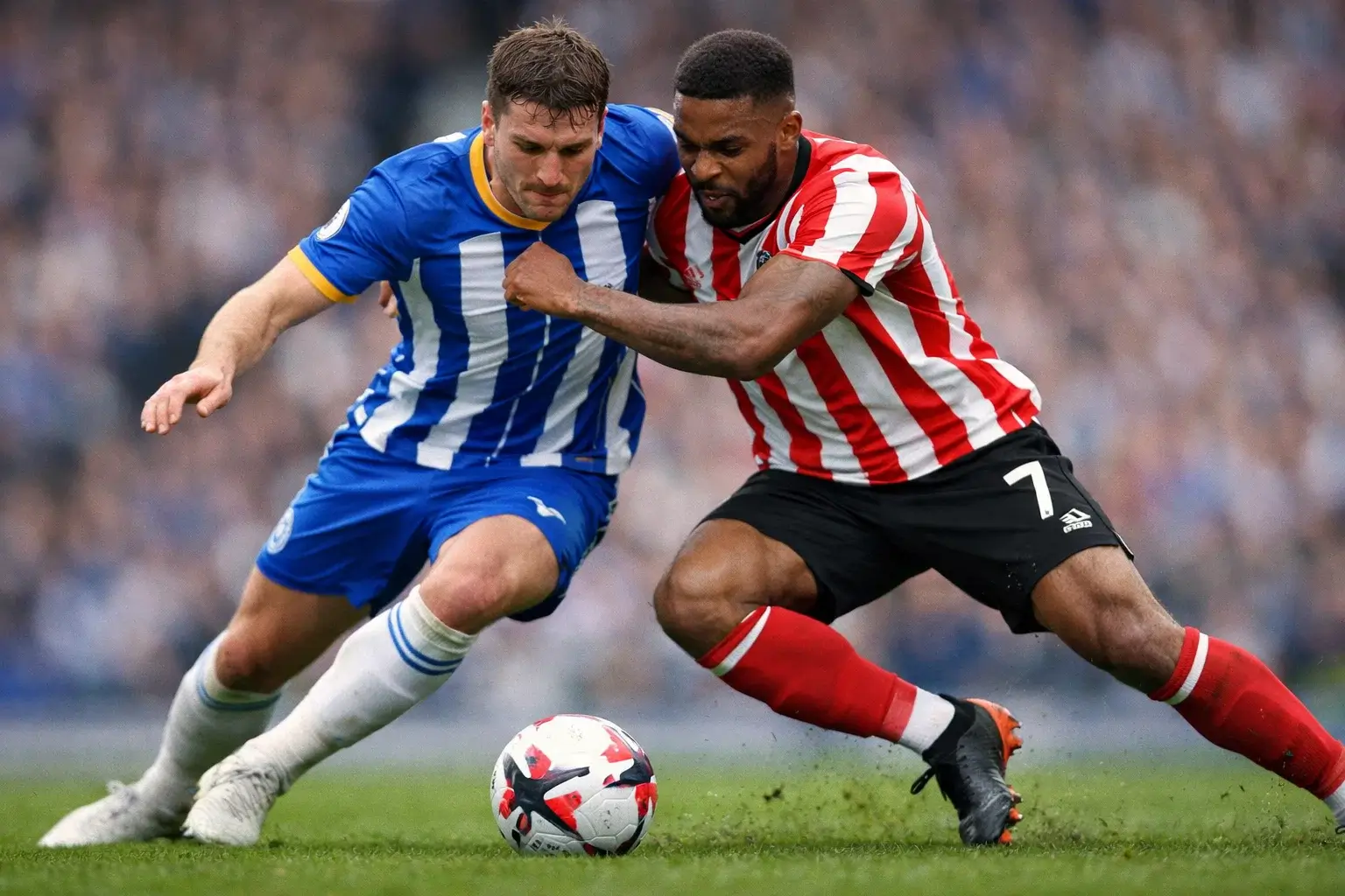 Brighton players competing intensely against Brentford in Premier League action
